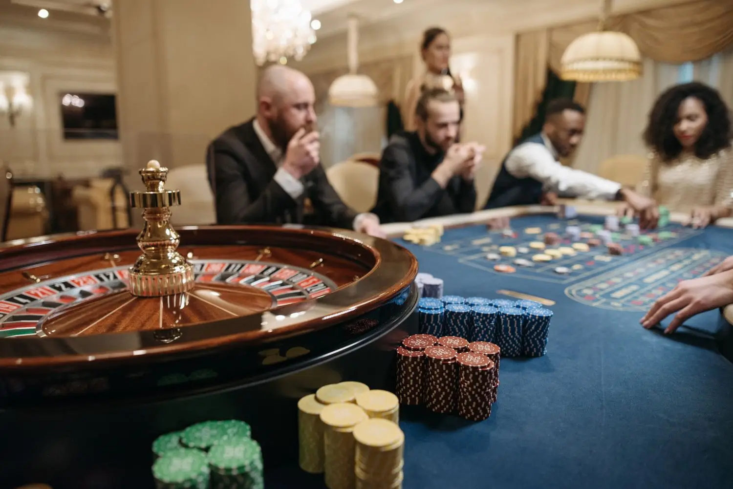 Guests gathered around a casino table
